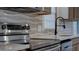 This kitchen has stainless steel appliances, light countertops and modern fixtures at 3669 General Marshall Rd, Daytona Beach, FL 32124