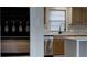 Kitchen with a wine rack, stainless steel appliances, and updated kitchen backsplash at 3669 General Marshall Rd, Daytona Beach, FL 32124