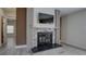 Stylish living room featuring a stone fireplace, modern design, and views into other rooms for connectivity at 3669 General Marshall Rd, Daytona Beach, FL 32124