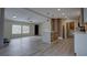 Open living space with luxury vinyl floors, modern lighting, island, and stainless steel appliances at 3669 General Marshall Rd, Daytona Beach, FL 32124