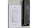Close-up of a modern style switch with a remote control device at 3669 General Marshall Rd, Daytona Beach, FL 32124