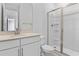 Bright bathroom featuring a clear glass shower and light countertops at 3773 Deer Ridge Dr, Mount Dora, FL 32757