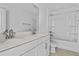 This spacious bathroom features a dual vanity and shower-tub combo at 3773 Deer Ridge Dr, Mount Dora, FL 32757