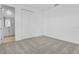 This carpeted bedroom has ample space and a bathroom just off to the left at 3773 Deer Ridge Dr, Mount Dora, FL 32757