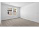 The spacious bedroom is bright and well-lit with neutral carpeting at 3773 Deer Ridge Dr, Mount Dora, FL 32757