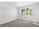Spacious bedroom with two large windows overlooking a beautiful neighborhood at 3773 Deer Ridge Dr, Mount Dora, FL 32757