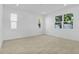 Bright bedroom featuring neutral walls, tile flooring, and multiple windows providing ample natural light at 3773 Deer Ridge Dr, Mount Dora, FL 32757