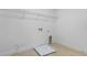 Bright laundry room with modern hookups, wire rack shelf, and space saving design at 3773 Deer Ridge Dr, Mount Dora, FL 32757