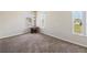 Bright bedroom featuring neutral walls, carpet flooring, and natural light from multiple windows at 410 Canna Dr, Davenport, FL 33897