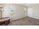 Cozy bedroom featuring neutral walls, carpet flooring, and natural light from multiple windows at 410 Canna Dr, Davenport, FL 33897