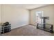 Neutral bedroom with carpet and a window, offering versatile space for furniture arrangements at 410 Canna Dr, Davenport, FL 33897
