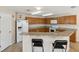 Spacious kitchen boasts granite countertops, a breakfast bar and modern appliances at 410 Canna Dr, Davenport, FL 33897
