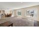 Open floor plan with living room adjacent to the kitchen and dining area with a pool view at 410 Canna Dr, Davenport, FL 33897