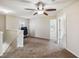 Spacious loft area with carpet flooring, a ceiling fan, and natural light, offering flexible living space at 410 Canna Dr, Davenport, FL 33897