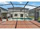 Large screened-in pool area with deck, back patio, and access to the home at 410 Canna Dr, Davenport, FL 33897
