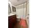 Bathroom with tile floors, a shower with curtain, toilet and sink at 4820 Conway Rd # 130, Orlando, FL 32812