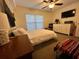 Bedroom with ceiling fan and window with blinds at 4820 Conway Rd # 130, Orlando, FL 32812