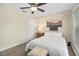 Cozy bedroom with a ceiling fan, a bright window, and a comfortable bed with neutral decor at 4820 Conway Rd # 130, Orlando, FL 32812