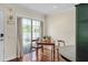 Bright dining area featuring hardwood floors and a window at 4820 Conway Rd # 130, Orlando, FL 32812