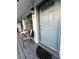 Inviting entrance with sliding glass doors, seating area, and a stylish front door at 4820 Conway Rd # 130, Orlando, FL 32812