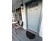 Inviting entrance with sliding glass doors, seating area, and a stylish front door at 4820 Conway Rd # 130, Orlando, FL 32812