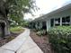 View of walkway with a bench in front of condo at 4820 Conway Rd # 130, Orlando, FL 32812