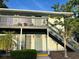 Charming condo with private balcony and stairs, showcasing a cozy outdoor living space at 4820 Conway Rd # 130, Orlando, FL 32812