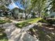 View of the front exterior with walkways and greenery at 4820 Conway Rd # 130, Orlando, FL 32812