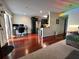 Open concept living room connected to the kitchen and work area with hardwood floors at 4820 Conway Rd # 130, Orlando, FL 32812