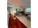 Living room with modern grey sectional sofa, a rug and hardwood floors at 4820 Conway Rd # 130, Orlando, FL 32812
