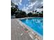 Community pool with marked depth, perfect for a swim in the Florida sunshine at 4820 Conway Rd # 130, Orlando, FL 32812
