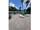 Pool patio with lounge chairs and table, perfect for relaxing by the community pool at 4820 Conway Rd # 130, Orlando, FL 32812