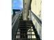 Exterior stairs lead to the second-story balcony at 4820 Conway Rd # 130, Orlando, FL 32812