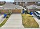 An aerial view displays several well-kept townhomes, landscaped yards and garages in a desirable community at 4909 Terrapin Blvd, St Cloud, FL 34771