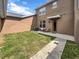 A quaint backyard features well-maintained grass and a peaceful patio setting for relaxation and enjoyment at 4909 Terrapin Blvd, St Cloud, FL 34771
