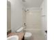 Neutral full bath features a tub shower combo, wood vanity, and modern fixtures at 4909 Terrapin Blvd, St Cloud, FL 34771