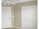 Neutral bedroom with closet, beige carpeting, and white trim at 4909 Terrapin Blvd, St Cloud, FL 34771