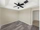 A well lit bedroom showcasing wood-look floors and a ceiling fan with a light at 4909 Terrapin Blvd, St Cloud, FL 34771