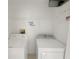 Laundry room featuring a washer, dryer, utility connections, and wire shelving at 4909 Terrapin Blvd, St Cloud, FL 34771