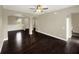 Expansive living room showcasing dark hardwood floors and neutral wall color at 4909 Terrapin Blvd, St Cloud, FL 34771