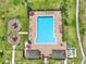 Overhead view of the community pool, playground, lounge chairs, and beautiful landscaping at 4909 Terrapin Blvd, St Cloud, FL 34771