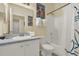 Well-lit bathroom featuring a shower-tub combination and neutral-toned decor at 550 Castlemain Cir, Davenport, FL 33897