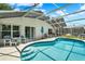 Inviting screened-in pool area with comfortable seating and ample space for entertaining at 550 Castlemain Cir, Davenport, FL 33897