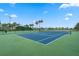 The community's tennis court offers residents a great opportunity for exercise and friendly competition at 550 Castlemain Cir, Davenport, FL 33897