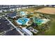Aerial view of water park and community pool with water slides and a clubhouse at 637 Ocean Course Ave, Davenport, FL 33896