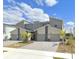 Contemporary townhomes featuring modern architectural design and attached garages at 637 Ocean Course Ave, Davenport, FL 33896