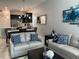 Open-concept living room and kitchen with modern furnishings, and dining area at 637 Ocean Course Ave, Davenport, FL 33896