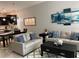 Open-concept living room and kitchen with modern furnishings, and dining area at 637 Ocean Course Ave, Davenport, FL 33896