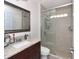 Updated bathroom featuring a vanity with granite countertops and a glass-enclosed shower at 639 Chadbury Way, Kissimmee, FL 34744