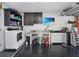 Spacious garage with epoxy floor, laundry area, sink, TV, and ample storage space at 639 Chadbury Way, Kissimmee, FL 34744